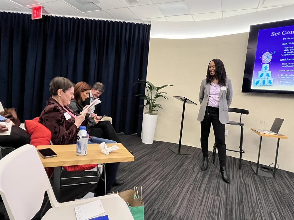 Alexis King presenting to a conference audience